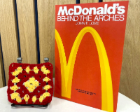 McDonalds Behind the Arches with a red and yellow granny square