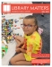 Little girl with glasses kneeling next to a pile of legos