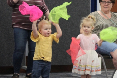 Kids dance with scarves