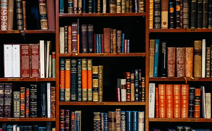 Yearbook and antique books on shelf